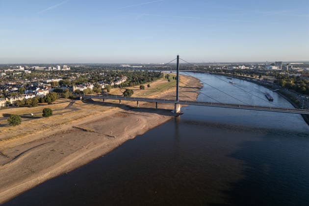 Drought pushes Rhine River to record-low water levels in Germany DUSSELDORF, GERMANY - AUGUST 11: An aerial view of a ship sailing past the partially dried-up riverbed of the Rhine River in Dusseldorf, Germany, on August 11, 2026. Water levels along the Rhine have reached record lows at measuring points across Germany due to ongoing drought and hot weather. The Rhine is a crucial shipping route for the region, and the transport of heavy cargo has already been severely disrupted. Hesham Elsherif Anadolu Dusseldorf Germany. Editorial use only. Please get in touch for any other usage.  Copyright: x2026xAnadoluxHeshamxElsherifx
