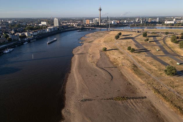 Drought pushes Rhine River to record-low water levels in Germany DUSSELDORF, GERMANY - AUGUST 11: An aerial view of a ship sailing past the partially dried-up riverbed of the Rhine River in Dusseldorf, Germany, on August 11, 2026. Water levels along the Rhine have reached record lows at measuring points across Germany due to ongoing drought and hot weather. The Rhine is a crucial shipping route for the region, and the transport of heavy cargo has already been severely disrupted. Hesham Elsherif Anadolu Dusseldorf Germany. Editorial use only. Please get in touch for any other usage.  Copyright: x2026xAnadoluxHeshamxElsherifx
