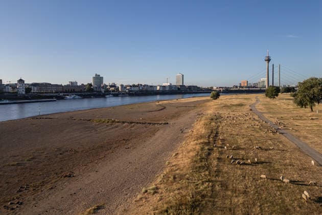 Drought pushes Rhine River to record-low water levels in Germany DUSSELDORF, GERMANY - AUGUST 11: An aerial view of a ship sailing past the partially dried-up riverbed of the Rhine River in Dusseldorf, Germany, on August 11, 2026. Water levels along the Rhine have reached record lows at measuring points across Germany due to ongoing drought and hot weather. The Rhine is a crucial shipping route for the region, and the transport of heavy cargo has already been severely disrupted. Hesham Elsherif Anadolu Dusseldorf Germany. Editorial use only. Please get in touch for any other usage.  Copyright: x2026xAnadoluxHeshamxElsherifx