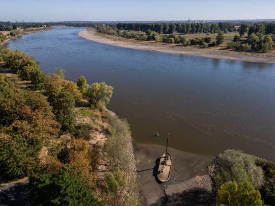 Drought pushes Rhine River to record-low water levels in Germany NEUSS, GERMANY - AUGUST 11: An aerial view of a former eel fishing boat stranded in dried mud along the banks of the Rhine River in Neuss, Germany, on August 11, 2026. Water levels at measuring points along the Rhine have reached record lows due to ongoing drought and hot weather. The Rhine is a crucial shipping route for the region, and the transport of heavy cargo has already been severely disrupted. Hesham Elsherif Anadolu Dusseldorf Germany. Editorial use only. Please get in touch for any other usage.  Copyright: x2026xAnadoluxHeshamxElsherifx