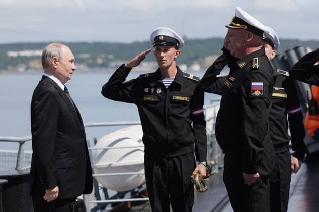 Russia Putin Far Eastern Federal District 9220806 12.08.2026 Russian President Vladimir Putin is greeted by commander of the Guards missile cruiser Varyag Captain 1st Rank Konstantin Petrov upon arrival aboard the cruiser during the final stage of the Pacific Fleet s exercises off the coast of Sakhalin region, Russia. Gavriil Grigorov Sputnik Sakhalin Region Russia  Copyright: xGavriilxGrigorovx