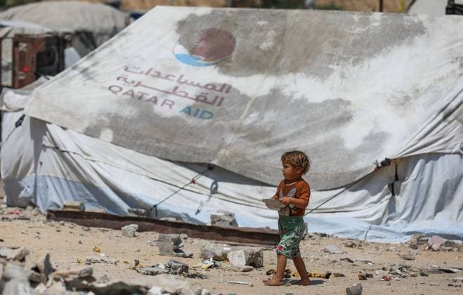 August 12, 2026, Khan Younis, Gaza, Palestine: A displaced Palestinian child outside a tent in the Al-Nahr Al-Bared area, south of Khan Younis, as extreme summer heat continues across Gaza. She lives in an overcrowded shelter, where high temperatures and limited protection have made daily life increasingly difficult for displaced families. Khan Younis Palestine - ZUMAq101 20260812_zna_q101_055 Copyright: xRamzixAbuxAmerx