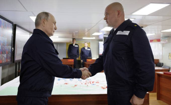August 12, 2026, Korsakov, Sakhalin Oblast, Russia: Russian President Vladimir Putin, shakes hands with an ships officer, right, during a tour of the Russian Navy Slava-class missile cruiser RF Varyag, August 12, 2026 in Korsakov, Sakhalin Oblast, Russia. Putin is visiting the remote island in the Russian Far East to view the Pacific Fleet naval exercises. Korsakov Russia - ZUMAp138 20260812_zaa_p138_004 Copyright: xGavriilxGrigorov RussianxGovernmx