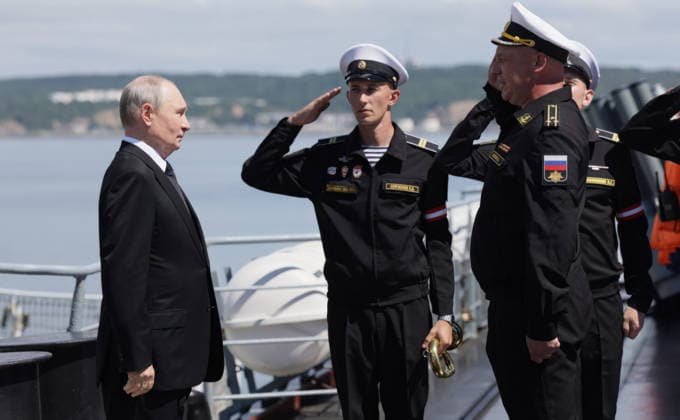 August 12, 2026, Korsakov, Sakhalin Oblast, Russia: Russian President Vladimir Putin, left, is welcomed aboard the Russian Navy Slava-class missile cruiser RF Varyag, by commander Captain 1st Rank Konstantin Petrovthe, right, August 12, 2026 in Korsakov, Sakhalin Oblast, Russia. Putin is visiting the remote island in the Russian Far East to view the Pacific Fleet naval exercises. Korsakov Russia - ZUMAp138 20260812_zaa_p138_006 Copyright: xGavriilxGrigorov RussianxGovernmx