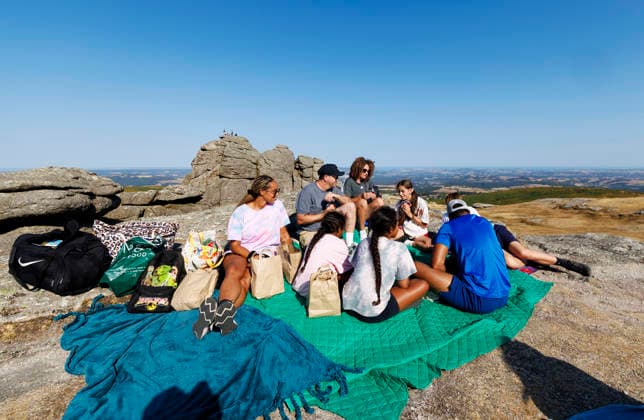 Solar eclipse, Haytor Dartmoor, Devon, UK - 12 Aug 2026 NEWS - The Sawyer and Sayed familes enjoying card before the solar eclipse at Haytor Rock ahead of the solar eclipse from Haytor, Dartmoor, Devon where people will come to view the eclipse on 12th August 2026. Haytor Dartmoor Devon GBR Copyright: xPhilxMingo PPAUKx PPA-297126