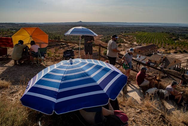 August 12, 2026, Lllardecans, Lleida, Spain: People gather at the highest point of the village of Llardecans, Lleida, moments before the solar eclipse. Lllardecans Spain - ZUMAb137 20260812_fap_b137_001 Copyright: xJordixBoixareux