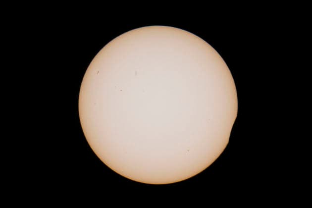 This image shows a partial solar eclipse captured in Hemiksem on %datetext. The moon will cover about 90% of the sun during this solar eclipse. %PHOTOGRAPHER  TomxGoyvaerts 183228876