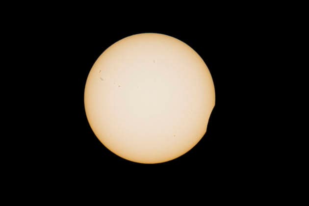 This image shows a partial solar eclipse captured in Hemiksem on %datetext. The moon will cover about 90% of the sun during this solar eclipse. %PHOTOGRAPHER  TomxGoyvaerts 183228880