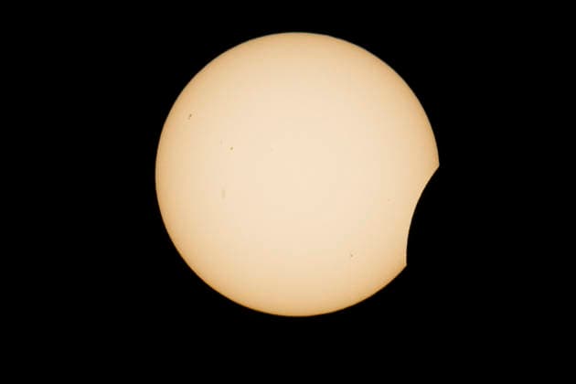 This image shows a partial solar eclipse captured in Hemiksem on %datetext. The moon will cover about 90% of the sun during this solar eclipse. %PHOTOGRAPHER  TomxGoyvaerts 183228925