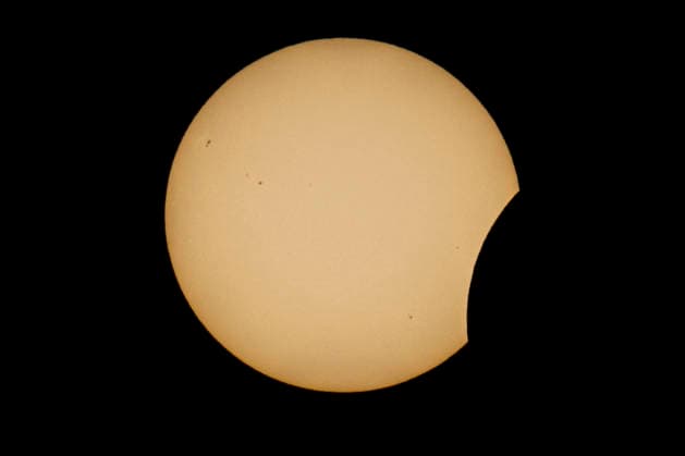 This image shows a partial solar eclipse captured in Hemiksem on %datetext. The moon will cover about 90% of the sun during this solar eclipse. %PHOTOGRAPHER  TomxGoyvaerts 183229018