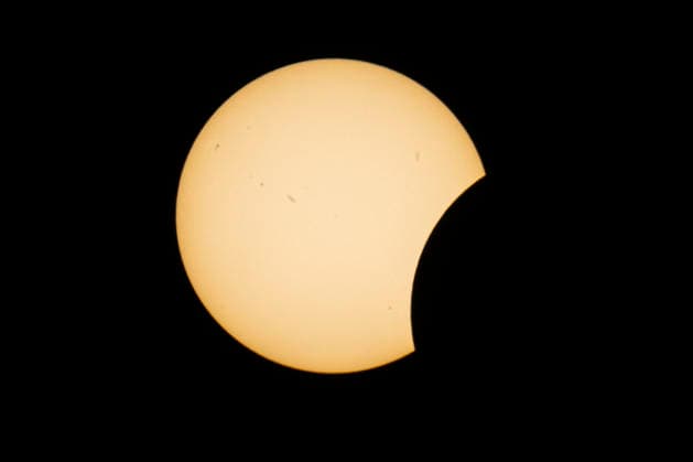 This image shows a partial solar eclipse captured in Hemiksem on %datetext. The moon will cover about 90% of the sun during this solar eclipse. %PHOTOGRAPHER  TomxGoyvaerts 183229045