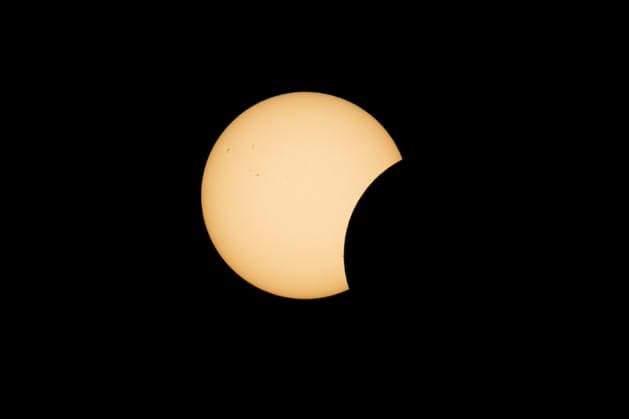 This image shows a partial solar eclipse captured in Hemiksem on %datetext. The moon will cover about 90% of the sun during this solar eclipse. %PHOTOGRAPHER  TomxGoyvaerts 183229114