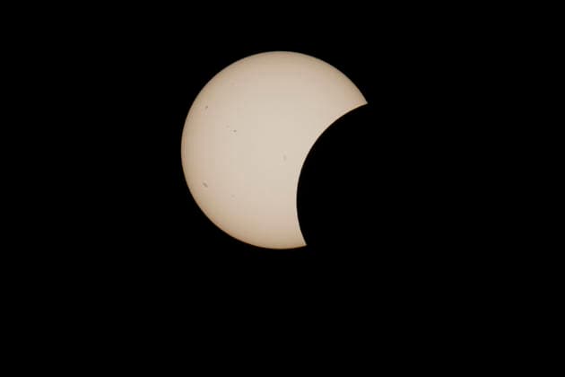 This image shows a partial solar eclipse captured in Hemiksem on %datetext. The moon will cover about 90% of the sun during this solar eclipse. %PHOTOGRAPHER  TomxGoyvaerts 183229304