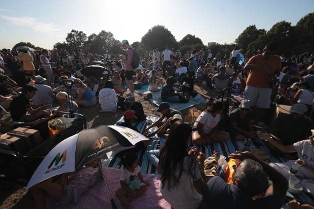 . 12 08 2026. London, United Kingdom. Partial Solar Eclipse. People gather on Primrose Hill in London to observe a Partial Solar Eclipse.  xMartynxWheatleyx xi-Imagesx IIM-26943-0019