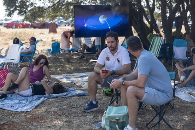 Sigüenza and Guadalajara Watch the 2026 Total Solar Eclipse Several people await the 2026 total solar eclipse, scheduled for August 12, 2026, in Sigüenza, Guadalajara, Castilla-La Mancha, Spain. This is the first total solar eclipse visible from the Iberian Peninsula in over a century. The path of totality crosses Spain from west to east and passes through numerous provincial capitals, from which observers will be able to catch a glimpse of the first phenomenon in the so-called trio of eclipses, since on August 2, 2027, another total eclipse will cross Spain, and on January 26, 2028, an annular eclipse will occur. AUGUST 12, 2026 SOLAR ECLIPSE TOTAL ECLIPSE PARTIAL MOON GLASSES Ananda Manjó Sigüenza, Guadalajara, Castile Sigüenza, Guadal  Copyright: xAnandaxManjonx 7711489