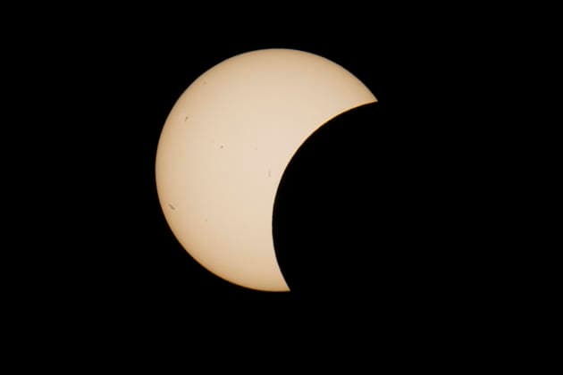 This image shows a partial solar eclipse captured in Hemiksem on %datetext. The moon will cover about 90% of the sun during this solar eclipse. %PHOTOGRAPHER  TomxGoyvaerts 183229599