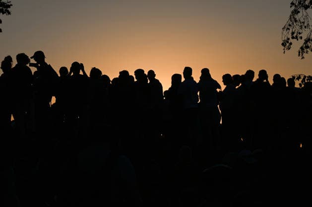 Hundreds Gather At Krakow s Historic Krakus Mound To Watch Solar Eclipse KRAKOW, POLAND - AUGUST 12: Spectators hold up smartphones to capture photos and videos as the sun sinks low on the horizon during a solar eclipse, on August 12, 2026 in Krakow, Poland. Hundreds of people gathered at the summit of the historic Krakus Mound (Kopiec Krakusa) to document the rare celestial event during the late afternoon sunset over Krakow. Krakow Poland  Copyright: xArturxWidakx originalFilename: widak-hundreds260812_nptaW.jpg