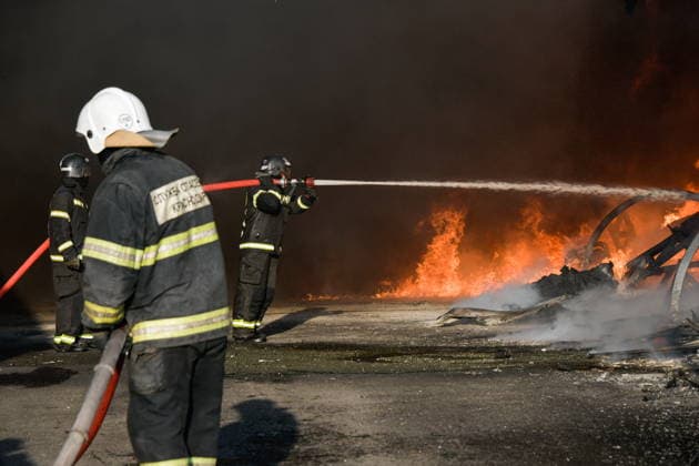 RUSSIA, KRASNODAR REGION - AUGUST 12, 2026: Employees of the Russian Emergencies Minsitry respond to a fire at a warehouse storing plastic products in the village of Lenina, southeast of Krasnodar. The fire covering an area of 2.2 thousand sq m has been contained. Roman Sokolov TASS  96070289