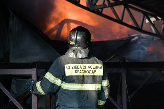 RUSSIA, KRASNODAR REGION - AUGUST 12, 2026: An employee of the Russian Emergencies Minsitry responds to a fire at a warehouse storing plastic products in the village of Lenina, southeast of Krasnodar. The fire covering an area of 2.2 thousand sq m has been contained. Roman Sokolov TASS  96070292