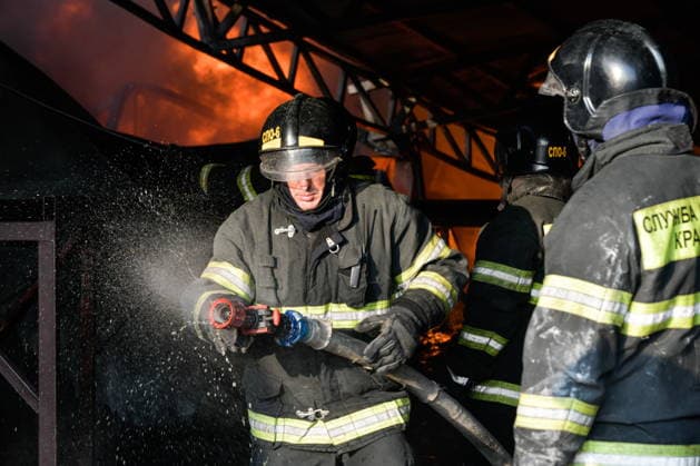 RUSSIA, KRASNODAR REGION - AUGUST 12, 2026: Employees of the Russian Emergencies Minsitry respond to a fire at a warehouse storing plastic products in the village of Lenina, southeast of Krasnodar. The fire covering an area of 2.2 thousand sq m has been contained. Roman Sokolov TASS  96070293