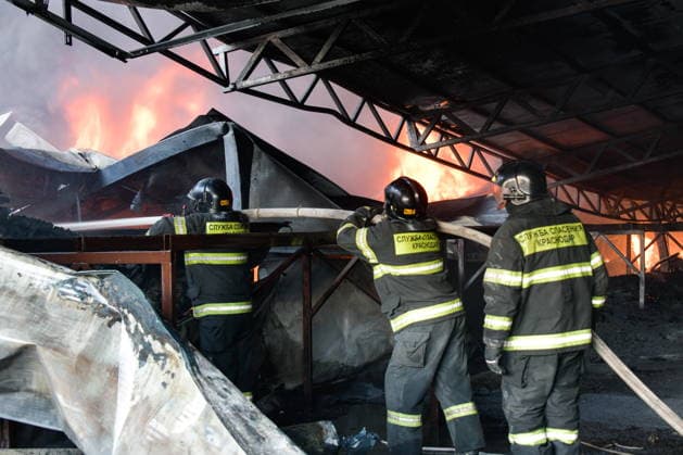 RUSSIA, KRASNODAR REGION - AUGUST 12, 2026: Employees of the Russian Emergencies Minsitry respond to a fire at a warehouse storing plastic products in the village of Lenina, southeast of Krasnodar. The fire covering an area of 2.2 thousand sq m has been contained. Roman Sokolov TASS  96070295