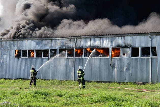RUSSIA, KRASNODAR REGION - AUGUST 12, 2026: Employees of the Russian Emergencies Minsitry respond to a fire at a warehouse storing plastic products in the village of Lenina, southeast of Krasnodar. The fire covering an area of 2.2 thousand sq m has been contained Russia  - ZUMAt113 20260812_zaa_t113_352 Copyright: xRomanxSokolovx