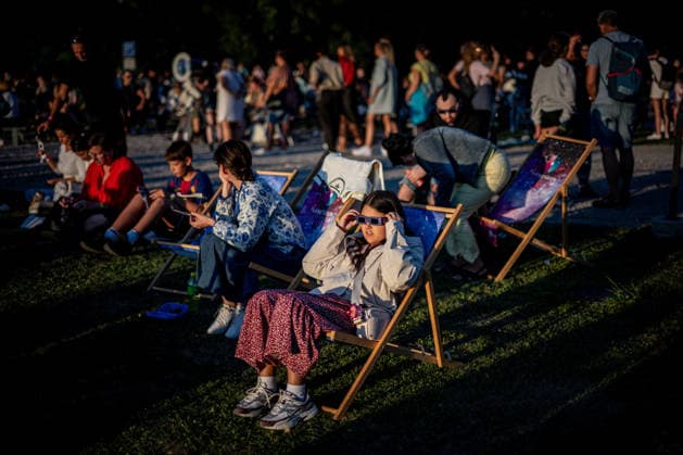 Partial solar eclipse in Czech Republic OSTRAVA, CZECH REPUBLIC - AUGUST 12: People, wearing protective eclipse glasses, observe a partial solar eclipse while sitting on a deck chair at Planetarium Ostrava in Ostrava, Czech Republic, on August 12, 2026. Lukas Kabon Anadolu Ostrava Czech Republic. Editorial use only. Please get in touch for any other usage.  Copyright: x2026xAnadoluxLukasxKabonx