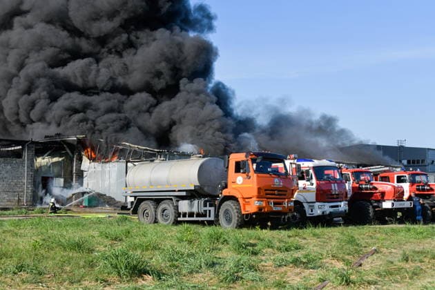 RUSSIA, KRASNODAR REGION - AUGUST 12, 2026: Smoke billows over a warehouse storing plastic products, hit by fire in the village of Lenina, southeast of Krasnodar. The fire covering an area of 2.2 thousand sq m has been contained. Roman Sokolov TASS  96070031