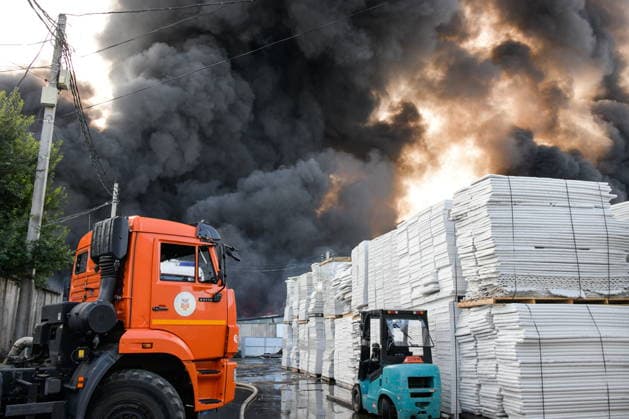 RUSSIA, KRASNODAR REGION - AUGUST 12, 2026: Smoke billows over a warehouse storing plastic products, hit by fire in the village of Lenina, southeast of Krasnodar. The fire covering an area of 2.2 thousand sq m has been contained. Roman Sokolov TASS  96070043