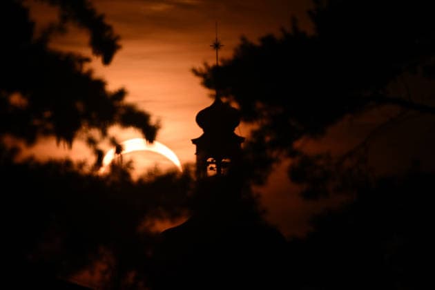 August 12, 2026, Mnichovo Hradiste, Czech Republic: Partial solar eclipse over the Church of St. James in Mnichovo Hradiste, Czech Republic. On August 12, 2026, nearly one billion people could potentially see a partial solar eclipse. Wednesday™s eclipse was mainland Europe™s first total solar eclipse since 1999. Mnichovo Hradiste Czech Republic  - ZUMAr156 20260812_aap_r156_001 Copyright: xSlavekxRutax