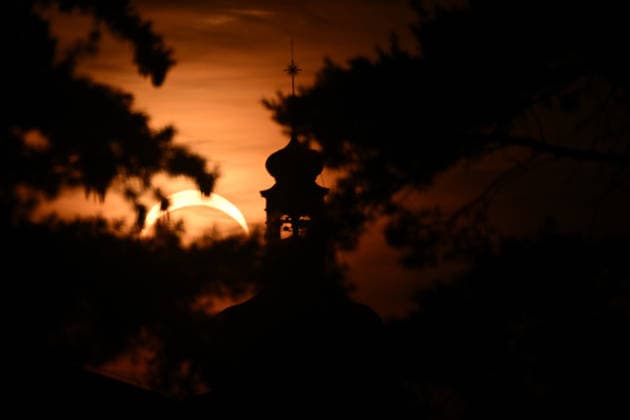August 12, 2026, Mnichovo Hradiste, Czech Republic: Partial solar eclipse over the Church of St. James in Mnichovo Hradiste, Czech Republic. On August 12, 2026, nearly one billion people could potentially see a partial solar eclipse. Wednesday™s eclipse was mainland Europe™s first total solar eclipse since 1999. Mnichovo Hradiste Czech Republic  - ZUMAr156 20260812_aap_r156_002 Copyright: xSlavekxRutax