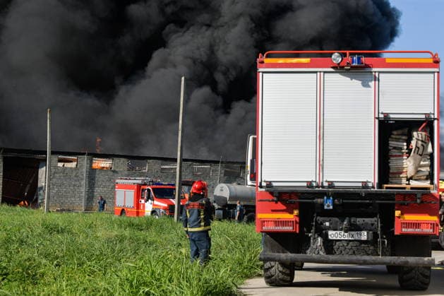 RUSSIA, KRASNODAR REGION - AUGUST 12, 2026: Smoke billows over a warehouse storing plastic products, hit by fire in the village of Lenina, southeast of Krasnodar. The fire covering an area of 2.2 thousand sq m has been contained Russia  - ZUMAt113 20260812_zaa_t113_378 Copyright: xRomanxSokolovx