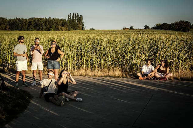 August 12, 2026: People observe the partial solar eclipse using eclipse glasses, improvised viewing devices and telescopes at several locations in Brussels, Belgium, Wednesday, 12.08.2026. The partial eclipse was visible across Belgium during the evening, drawing residents and amateur astronomers to open spaces to watch the phenomenon. - ZUMAw80_ 20260812_faf_w80_003 Copyright: xWiktorxDabkowskix