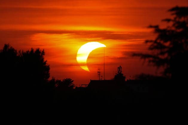 The moon covers the sun during a partial solar eclipse in Spinaceto, a neighbourhood on the outskirts of Rome on August 12, 2026. AntoniettaxBaldassarre
