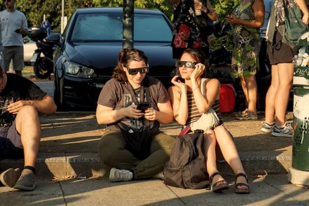 August 12, 2026, Torino, Italy: TURIN, ITALY Ã¢â‚¬ AUGUST 12, 2026: Hundreds of people gather in front of the Basilica of Superga, one of Turin s highest viewpoints, to observe a partial solar eclipse at sunset on August 12, 2026. Spectators used eclipse glasses and other viewing devices as the Moon obscured most of the solar disc, with the phenomenon reaching its maximum visible phase in the Turin area at around 8:30 p.m. Torino Italy - ZUMAq101 20260812_zna_q101_228 Copyright: xChiaraxAntenuccix