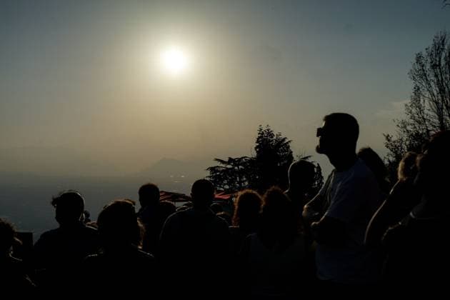 August 12, 2026, Torino, Italy: TURIN, ITALY Ã¢â‚¬ AUGUST 12, 2026: Hundreds of people gather in front of the Basilica of Superga, one of Turin s highest viewpoints, to observe a partial solar eclipse at sunset on August 12, 2026. Spectators used eclipse glasses and other viewing devices as the Moon obscured most of the solar disc, with the phenomenon reaching its maximum visible phase in the Turin area at around 8:30 p.m. Torino Italy - ZUMAq101 20260812_zna_q101_233 Copyright: xChiaraxAntenuccix
