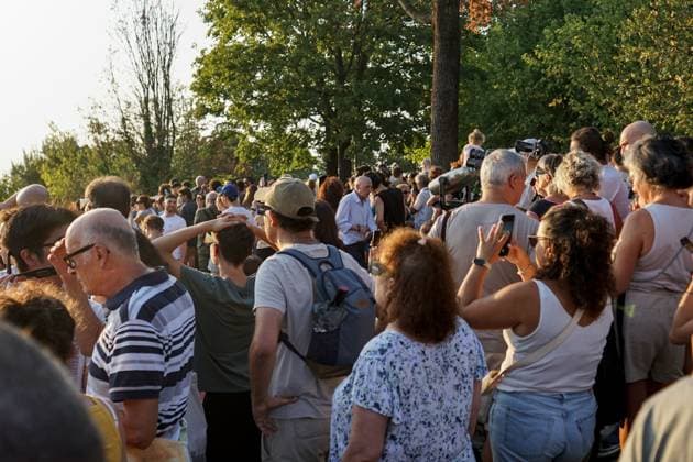 August 12, 2026, Torino, Italy: TURIN, ITALY Ã¢â‚¬ AUGUST 12, 2026: Hundreds of people gather in front of the Basilica of Superga, one of Turin s highest viewpoints, to observe a partial solar eclipse at sunset on August 12, 2026. Spectators used eclipse glasses and other viewing devices as the Moon obscured most of the solar disc, with the phenomenon reaching its maximum visible phase in the Turin area at around 8:30 p.m. Torino Italy - ZUMAq101 20260812_zna_q101_239 Copyright: xChiaraxAntenuccix
