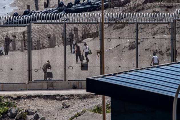 Morocco reinforces border security as migrants continue to leave Ceuta CEUTA, SPAIN AUGUST 12, 2026: Moroccan security forces reinforce measures on the Moroccan side of the Tarajal border area amid efforts to prevent further migrant crossings into the Spanish enclave of Ceuta on August 12, 2026. According to figures provided by Spain s Guardia Civil, migrants who entered Ceuta during the July 30 surge continue to leave voluntarily through a designated crossing point, with approximately 500 people departing the enclave over the previous 48 hours. Ceuta Spain Copyright: x xAntonioxSemperex xJNAxPressx