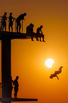 (260812) -- ZADAR, Aug. 12, 2026 -- People queue to dive at Kolovare Beach as the moon partially covers the sun during a solar eclipse in Zadar, Croatia, Aug. 12, 2026. (Zvonimir Barisin PIXSELL via Xinhua) CROATIA-ZADAR-SOLAR ECLIPSE-DIVING MaxZhen 