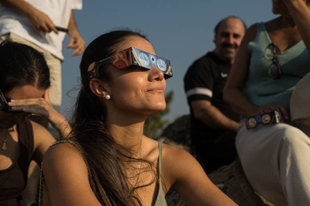 August 13, 2026, Castro Caldelas, Spain: CASTRO CALDELAS, GALICIA, SPAIN Ã¢â‚¬ AUGUST 12, 2026: People watch a solar eclipse over the Sil River Canyon from the MatacoÂ¡s viewpoint in Castro Caldelas, Galicia, northwestern Spain, on August 12, 2026. Castro Caldelas Spain - ZUMAq101 20260813_zna_q101_001 Copyright: xBraisxLorenzox