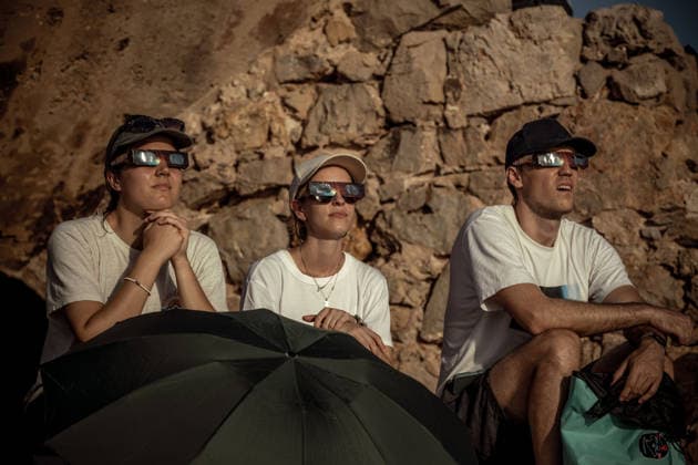 August 12, 2026, Ciutadella, Balearic Islands Menorca, Spain: People wearing protective glasses watch a total solar eclipse at Punta Nati on the Spanish Balearic island of Menorca. Ciutadella Spain - ZUMAo105 20260812_fap_o105_017 Copyright: xMatthiasxOesterlex