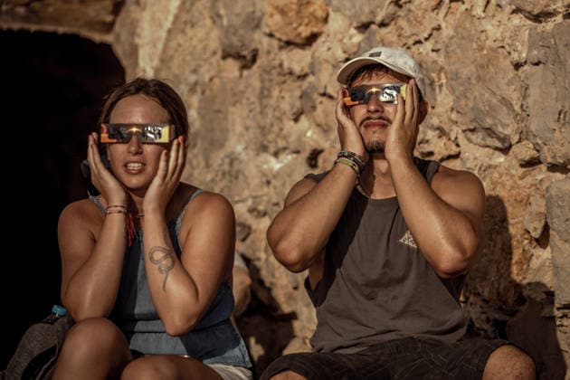 August 12, 2026, Ciutadella, Balearic Islands Menorca, Spain: A couple wearing protective glasses watch a total solar eclipse at Punta Nati on the Spanish Balearic island of Menorca. Ciutadella Spain - ZUMAo105 20260812_fap_o105_019 Copyright: xMatthiasxOesterlex
