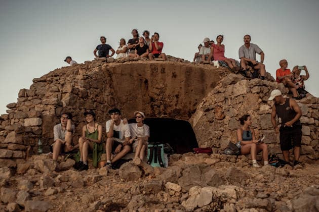 August 12, 2026, Ciutadella, Balearic Islands Menorca, Spain: People wearing protective glasses watch a total solar eclipse at Punta Nati on the Spanish Balearic island of Menorca. Ciutadella Spain - ZUMAo105 20260812_fap_o105_028 Copyright: xMatthiasxOesterlex