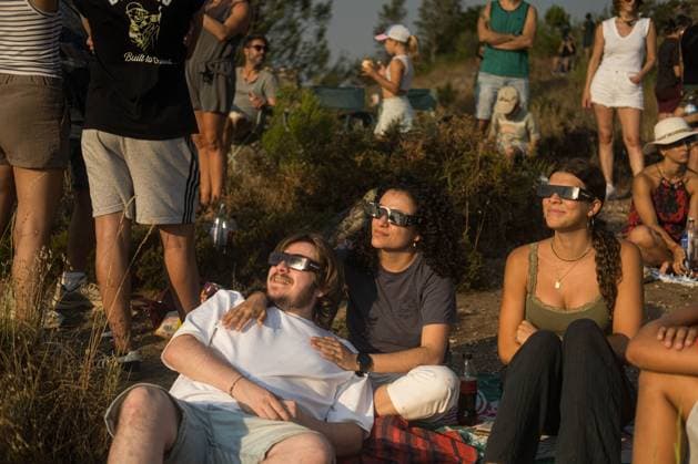 August 13, 2026, Castro Caldelas, Spain: CASTRO CALDELAS, GALICIA, SPAIN Ã¢â‚¬ AUGUST 12, 2026: People watch a solar eclipse over the Sil River Canyon from the MatacoÂ¡s viewpoint in Castro Caldelas, Galicia, northwestern Spain, on August 12, 2026. Castro Caldelas Spain - ZUMAq101 20260813_zna_q101_002 Copyright: xBraisxLorenzox