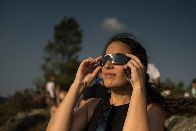 August 13, 2026, Castro Caldelas, Spain: CASTRO CALDELAS, GALICIA, SPAIN Ã¢â‚¬ AUGUST 12, 2026: People watch a solar eclipse over the Sil River Canyon from the MatacoÂ¡s viewpoint in Castro Caldelas, Galicia, northwestern Spain, on August 12, 2026. Castro Caldelas Spain - ZUMAq101 20260813_zna_q101_003 Copyright: xBraisxLorenzox