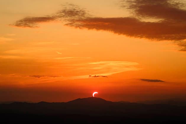 Solar Eclipse over Mount Nerone A solar eclipse photographed from Top of Mount Nerone, at 1,550 metres above sea level in the Tusco-Romagnolo Apennines, Italy. From this latitude, the eclipse was visible only as a partial eclipse. Italy Copyright: xAndreaxCalandrax