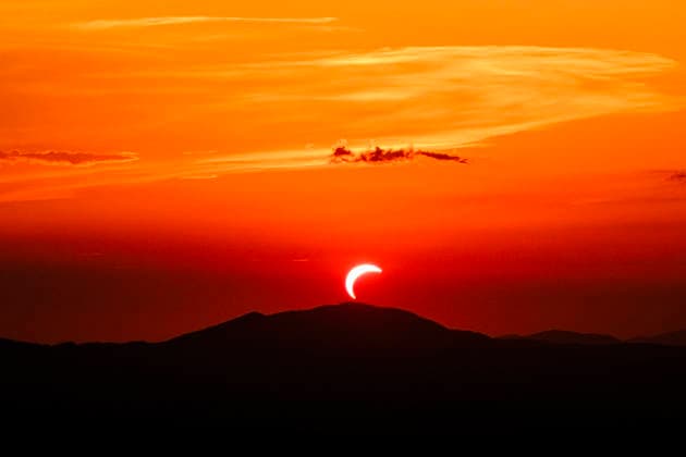 Solar Eclipse over Mount Nerone A solar eclipse photographed from Top of Mount Nerone, at 1,550 metres above sea level in the Tusco-Romagnolo Apennines, Italy. From this latitude, the eclipse was visible only as a partial eclipse. Italy Copyright: xAndreaxCalandrax