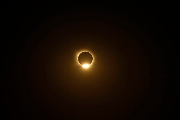 August 12, 2026, Madrid, Madrid, Spain: The distinct and breathtaking phases of a rare total solar eclipse unfold across the celestial sphere above Madrid, captured from the elevated open grounds of the Parque Forestal de Valdebebas - Felipe VI on Wednesday, August 12, 2026. Marking the first total solar eclipse visible from the Spanish mainland in 114 years, this monumental astronomical milestone traces the dramatic progression from the initial partial contact through the intermediate stages, culminating in the sublime beauty of totality. The sequence captures the razor-thin crescent of sunlight, the gradual occlusion of the solar disk by the Moon, and the ethereal, pearly-white wisps of the solar corona stretching into the darkening eveni - ZUMAo127 20260812_zep_o127_035 Copyright: xHugoxOrtunox