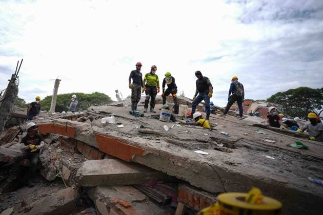 (260812) -- CALI, Aug. 12, 2026 -- Rescuers conduct search and rescue operations on the ruins of a building damaged in an earthquake in Cali, Colombia, Aug. 12, 2026. The death toll from Monday s 7.4-magnitude earthquake in western Colombia has risen to 241, with 3,771 others injured, Colombian media reported Wednesday, citing figures from the National Unit for Disaster Risk Management. (Photo by Xinhua) COLOMBIA-CALI-EARTHQUAKE-SEARCH AND RESCUE AndresxMoreno 