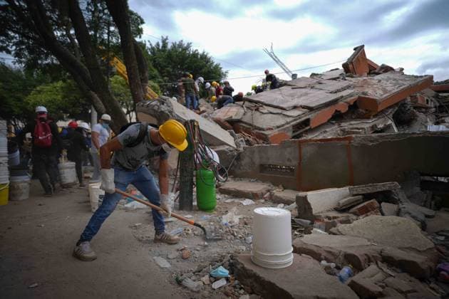 (260812) -- CALI, Aug. 12, 2026 -- Rescuers conduct search and rescue operations on the ruins of a building damaged in an earthquake in Cali, Colombia, Aug. 12, 2026. The death toll from Monday s 7.4-magnitude earthquake in western Colombia has risen to 241, with 3,771 others injured, Colombian media reported Wednesday, citing figures from the National Unit for Disaster Risk Management. (Photo by Xinhua) COLOMBIA-CALI-EARTHQUAKE-SEARCH AND RESCUE AndresxMoreno 